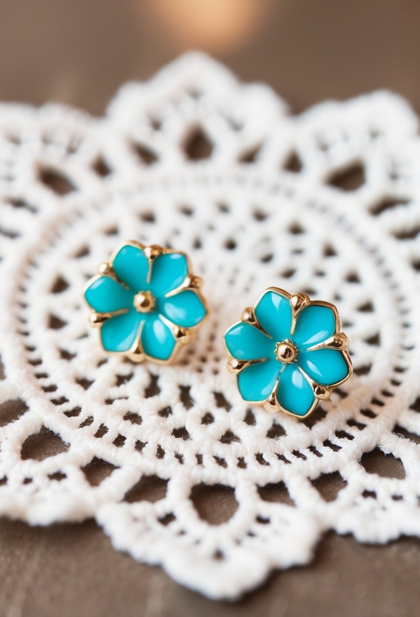 A pair of turquoise floral studs on a white lace background