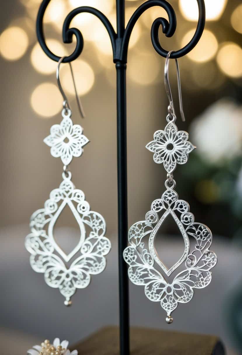 Delicate floral filigree earrings suspended from a metalwork display, with intricate three-hole design for wedding inspiration