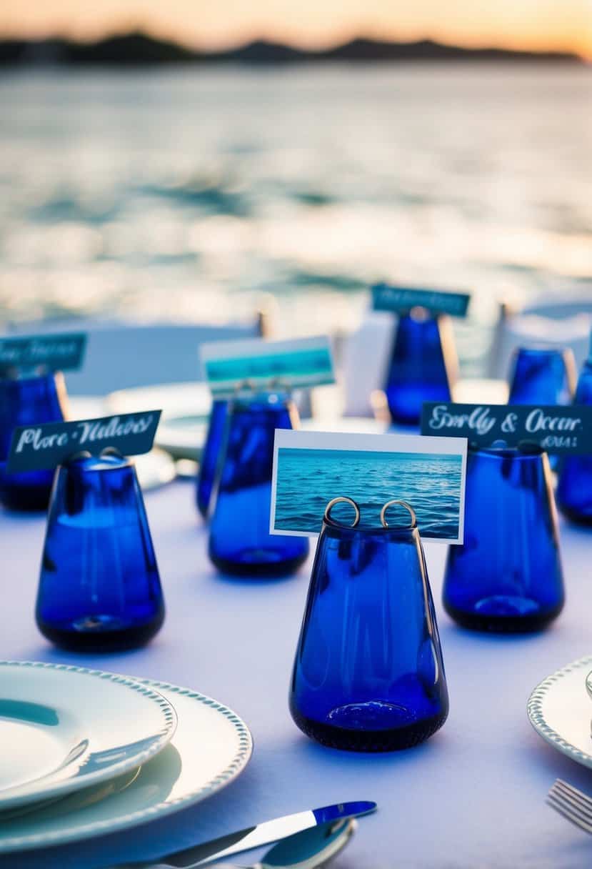 Dark blue sea glass place card holders arranged on a wedding table with ocean-themed decor