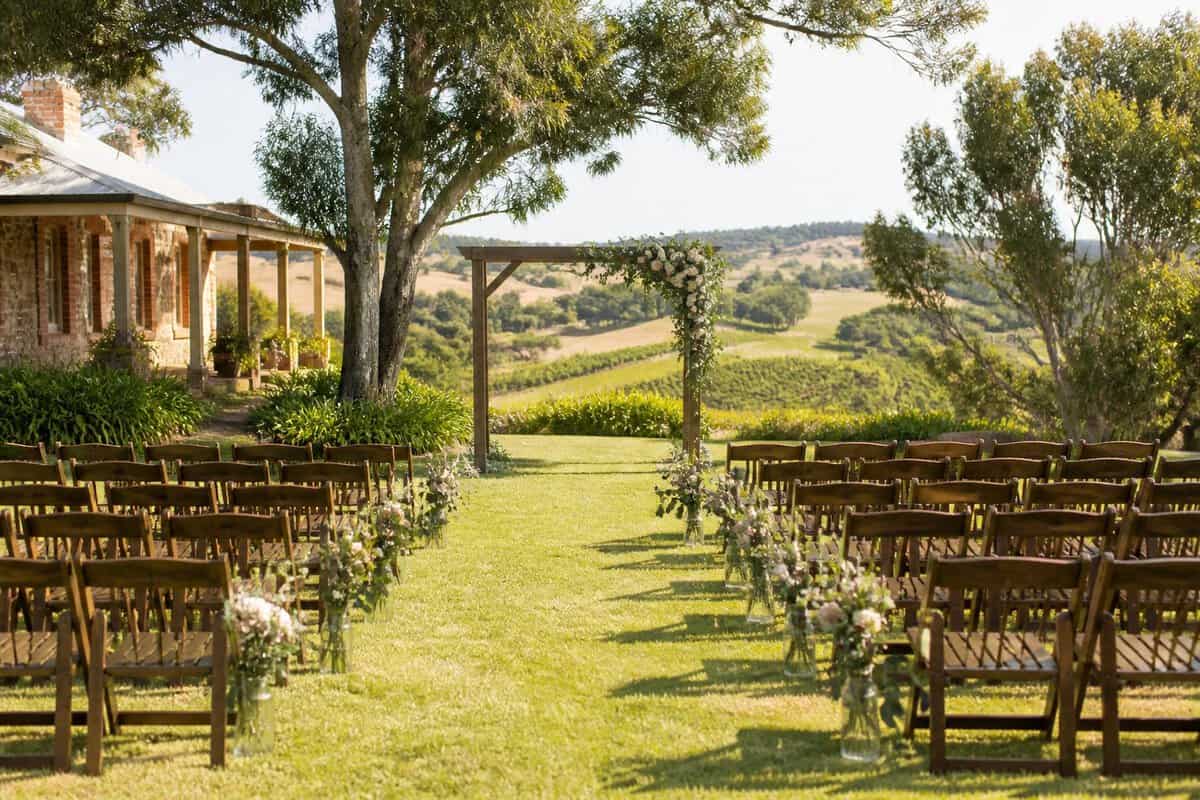A simple outdoor wedding ceremony set up at a scenic Adelaide countryside venue.