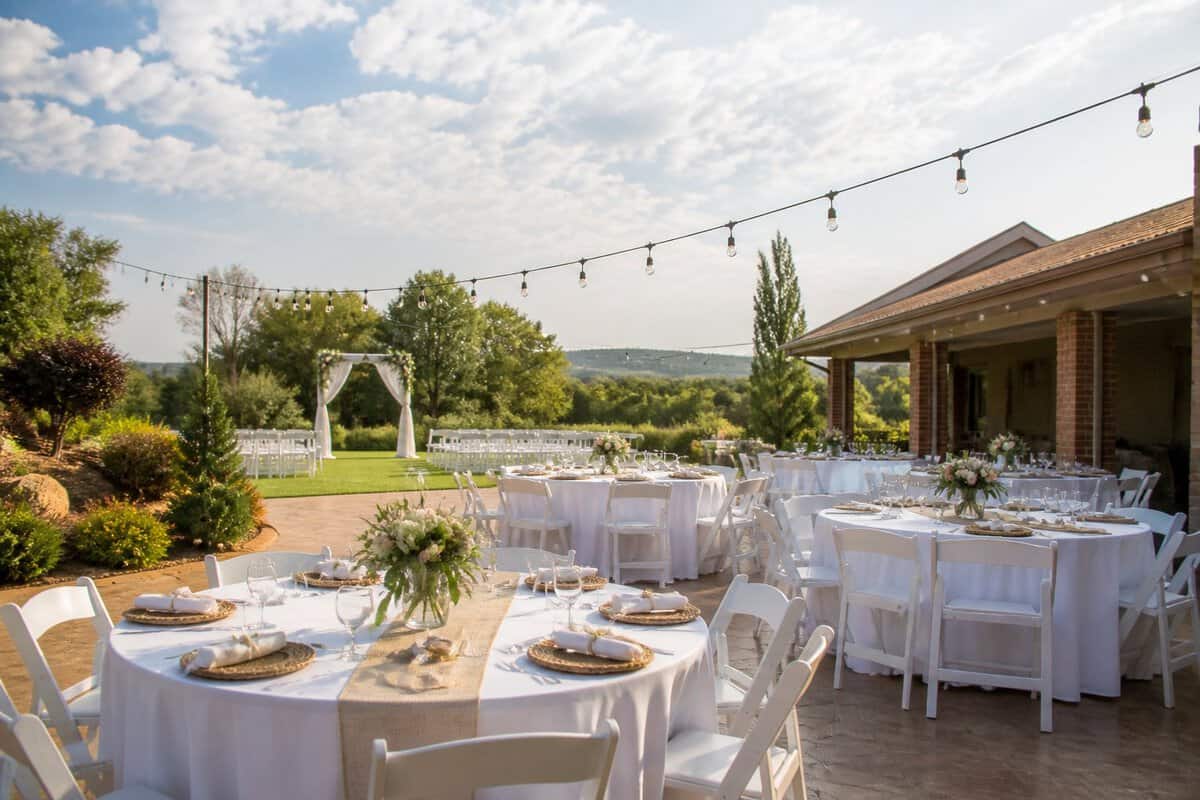 An elegantly arranged outdoor wedding reception at an affordable garden venue.