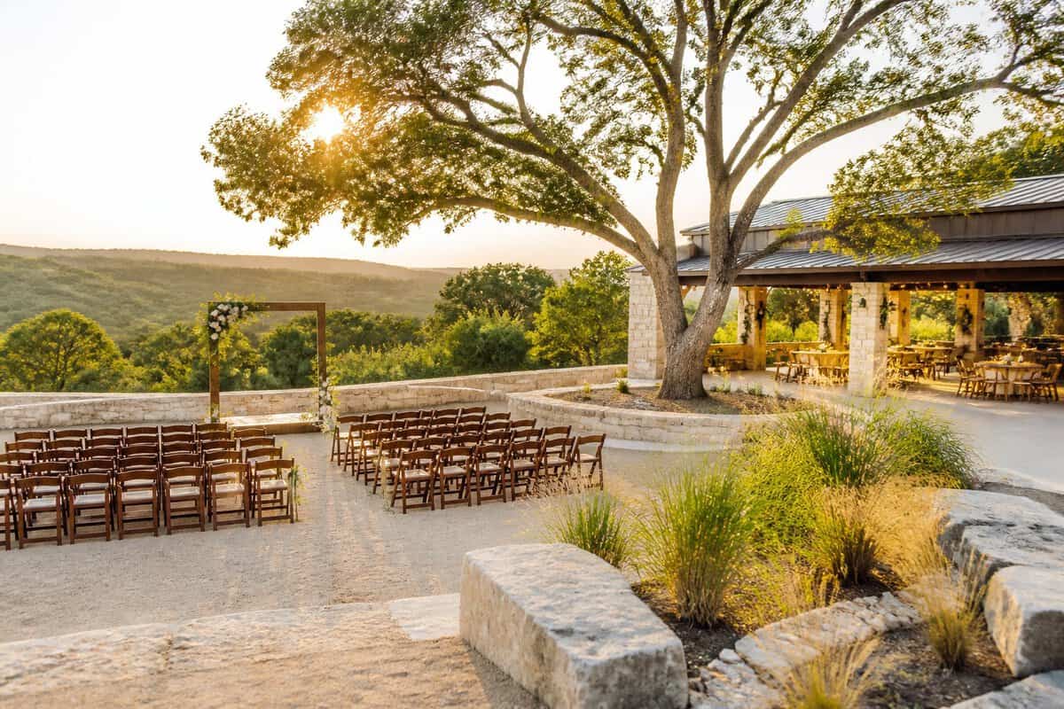 An affordable-looking wedding venue in the Texas Hill Country with simple outdoor ceremony seating and a rustic event space.