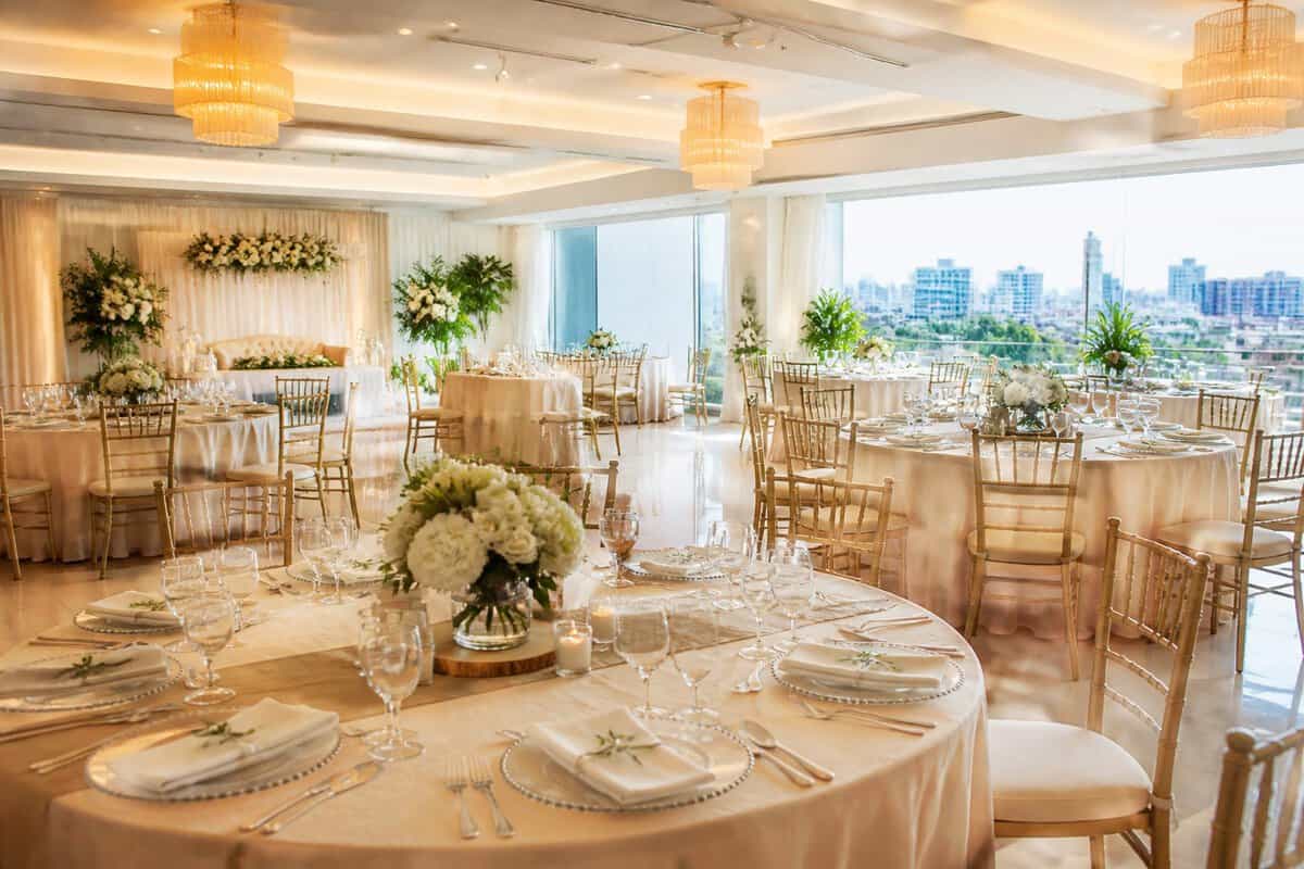 An elegant, affordable-looking wedding reception venue in Manila with decorated tables and soft floral arrangements.