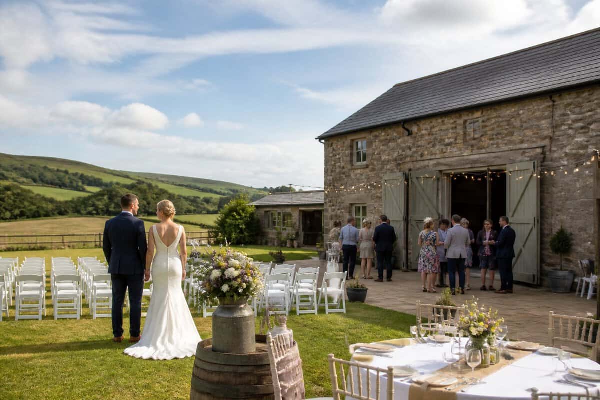 A modest countryside wedding venue near Longridge with simple outdoor ceremony seating and green hills in the background.