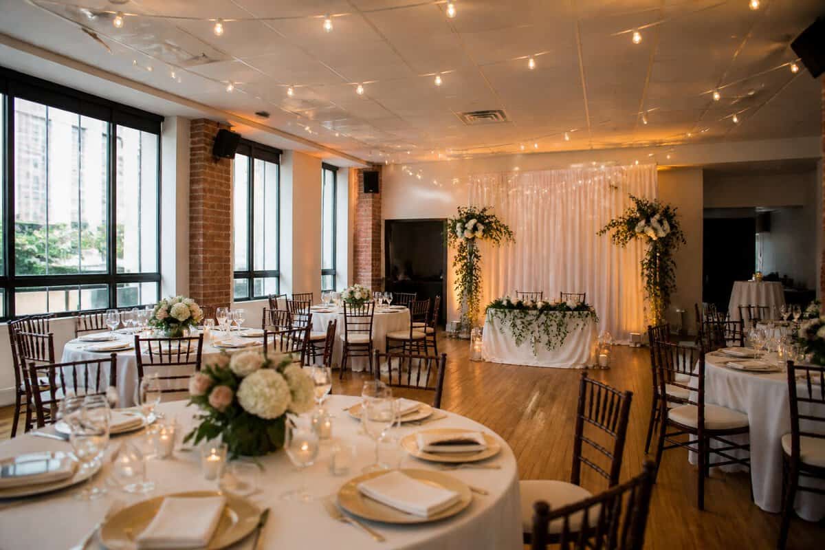 An affordable wedding reception venue in Queens with decorated tables, soft lighting, and a welcoming event space.