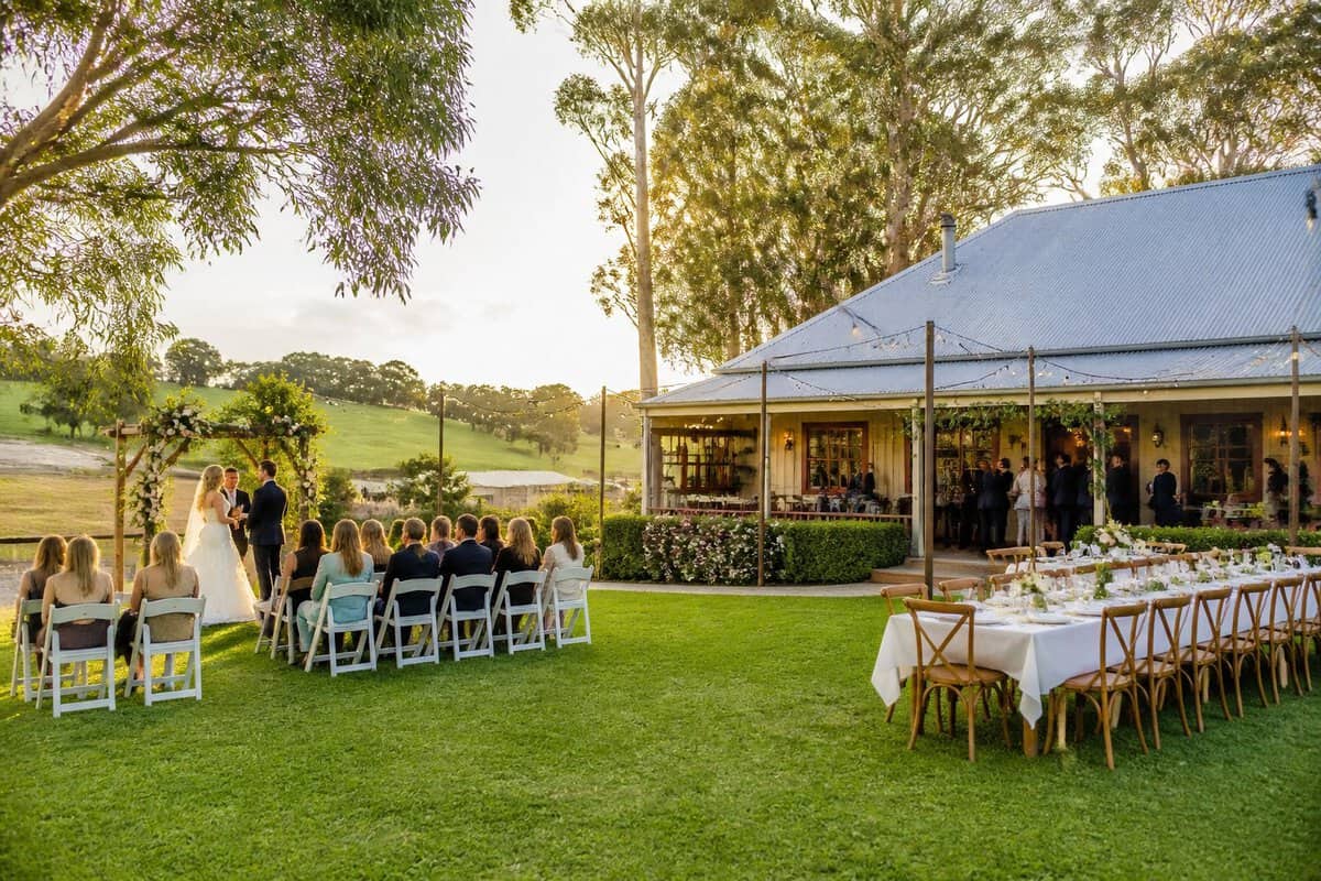A modest outdoor wedding ceremony and reception at a charming landscaped venue in Victoria.