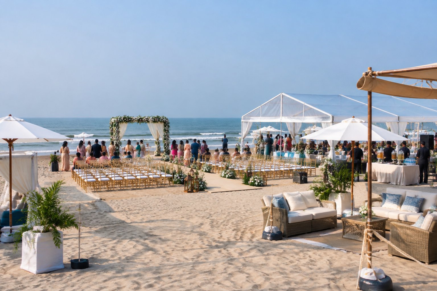 A planned beach wedding setup in Chennai with a covered ceremony area, shaded guest seating, umbrellas, and the ocean in the background.