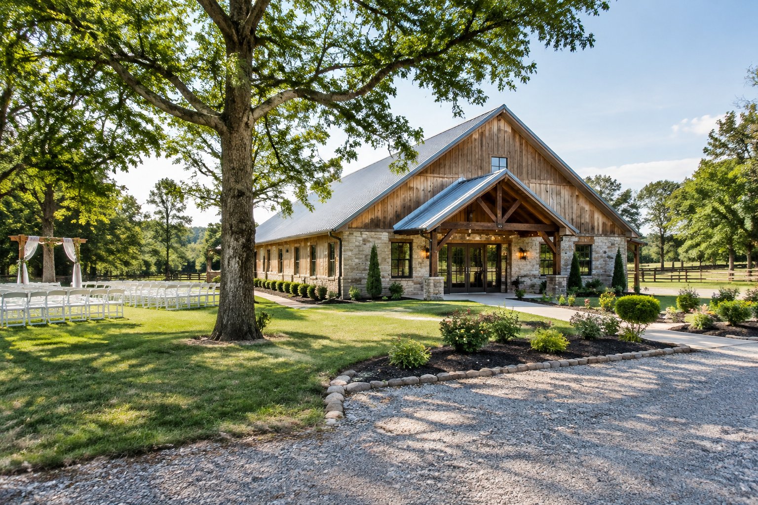 A modest countryside wedding venue with a renovated barn, landscaped lawn, ceremony area, and parking.