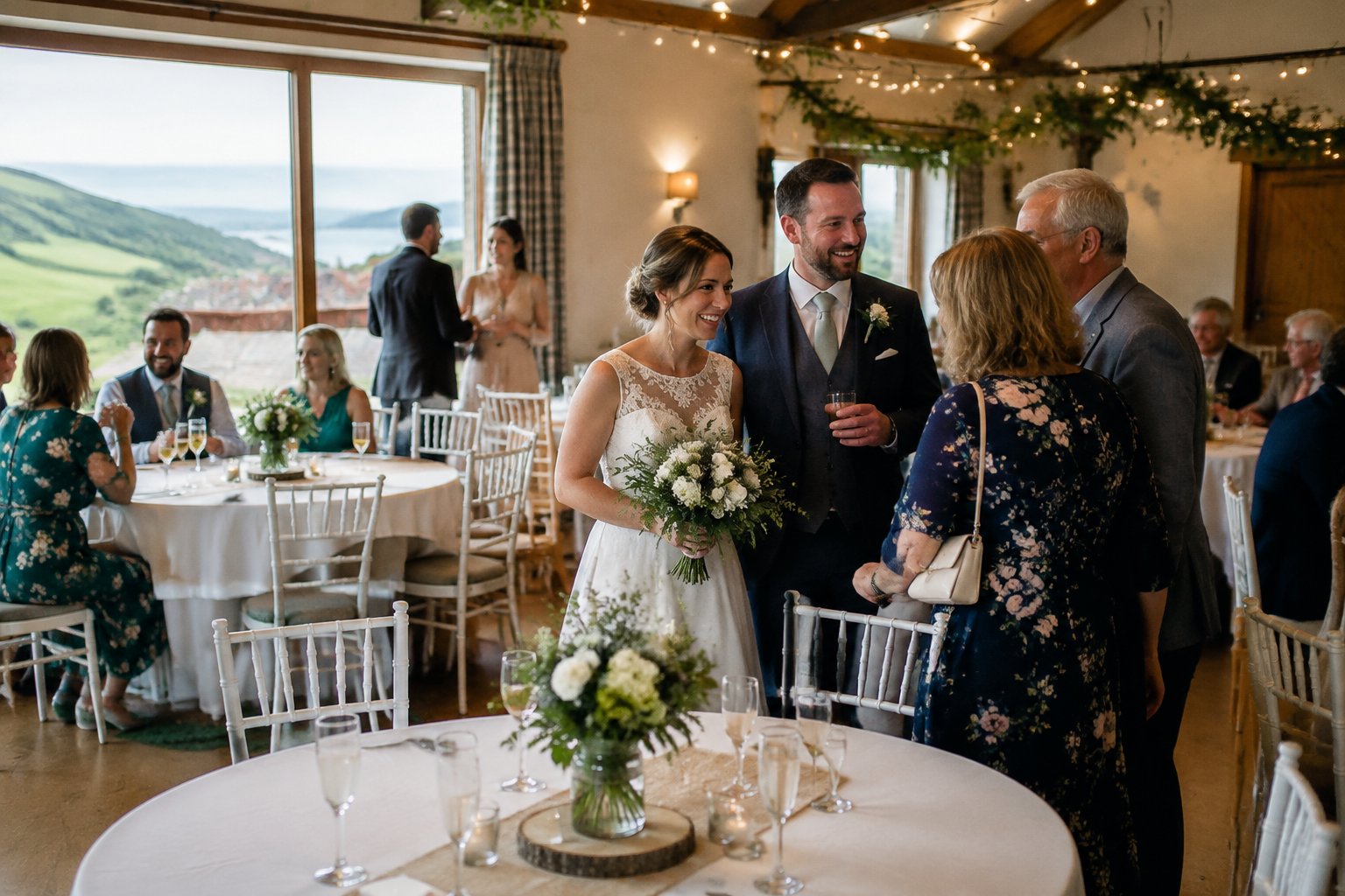 A couple celebrates with guests at an affordable wedding venue in the North East countryside.