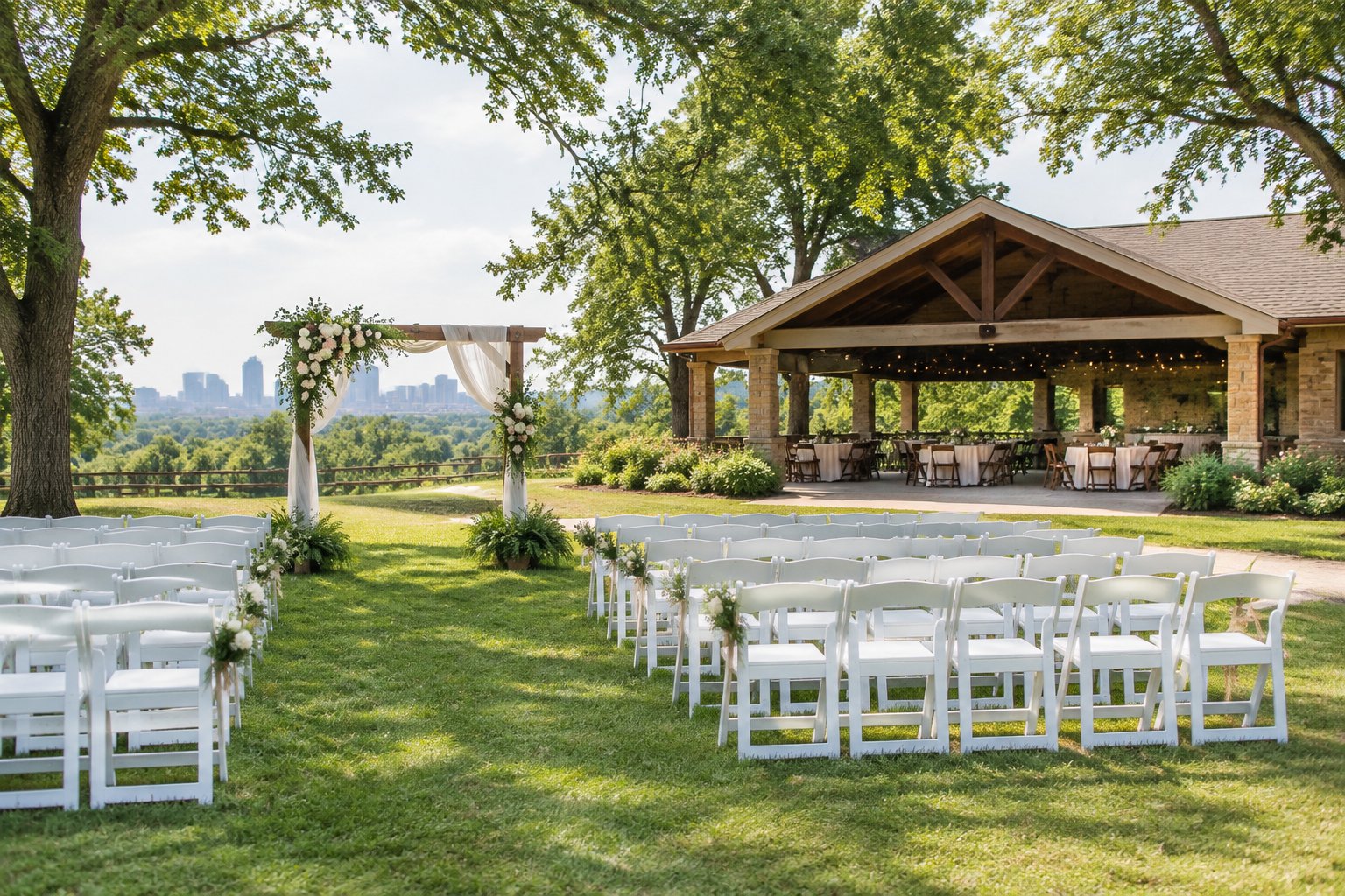 A modest wedding venue with white chairs, a floral arbor, and green outdoor surroundings.