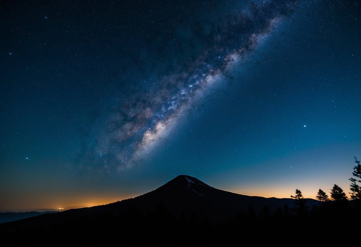 A clear night sky over Mount Lofty, with stars twinkling and the Milky Way visible, surrounded by the silhouette of trees and hills