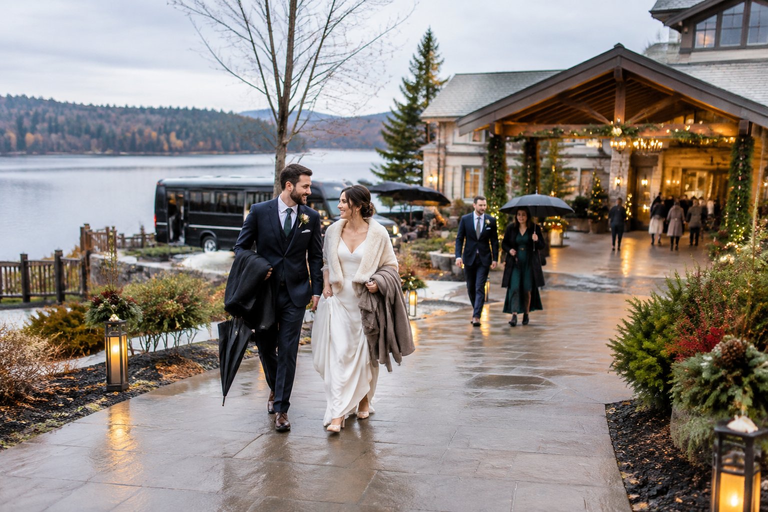 Wedding guests arrive at a lakeside venue on a cool, cloudy day.