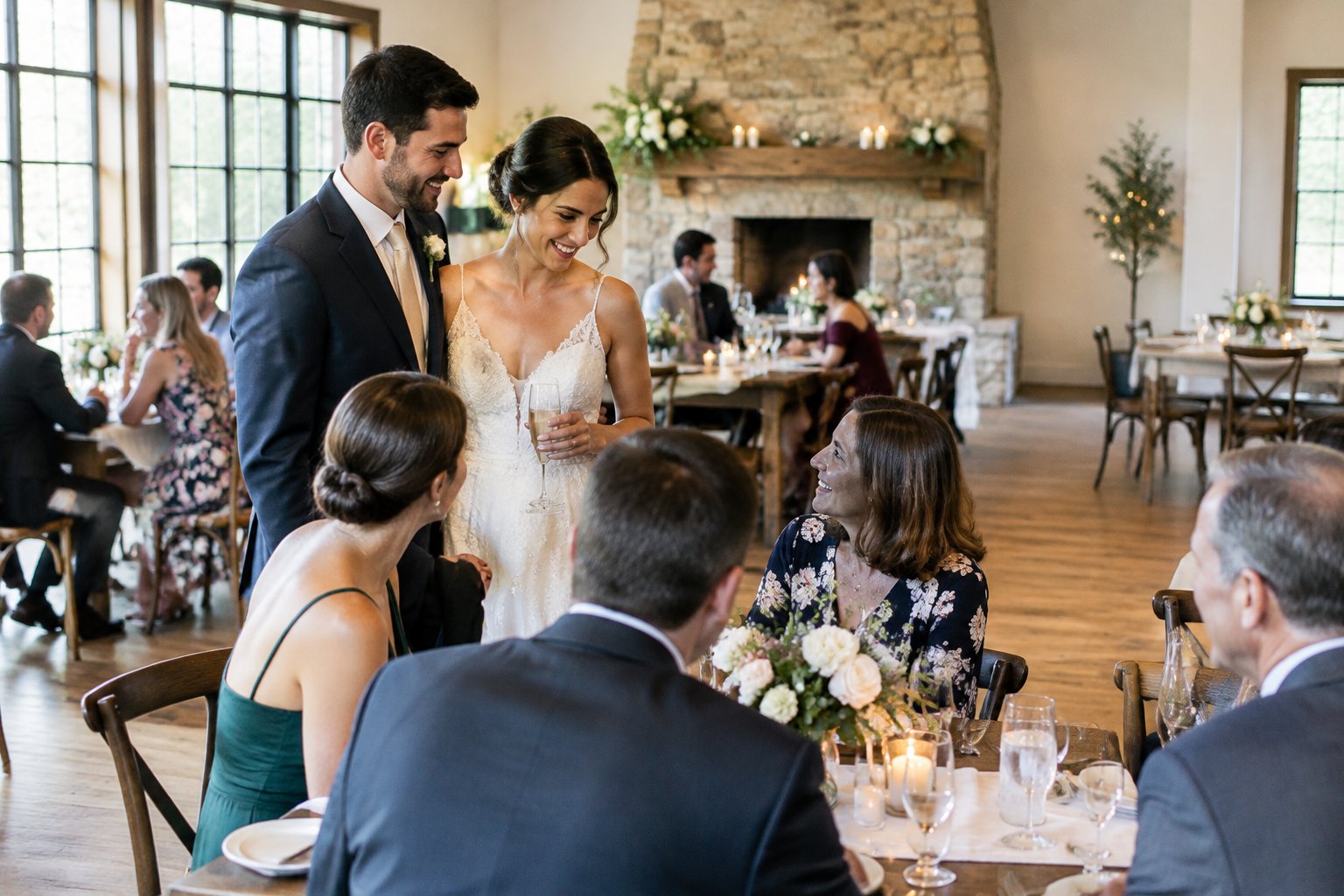 A newly married couple celebrates with family and friends at a small wedding reception.