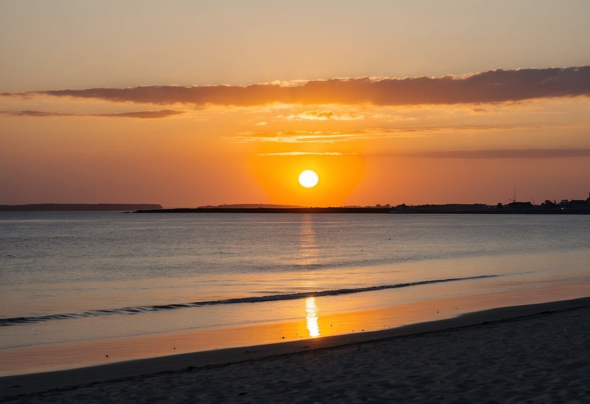 The sun sets over Moesgård Beach, casting a warm glow over the tranquil waters and sandy shore, creating a romantic atmosphere for a date in Aarhus